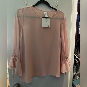 Woman’s light pink top